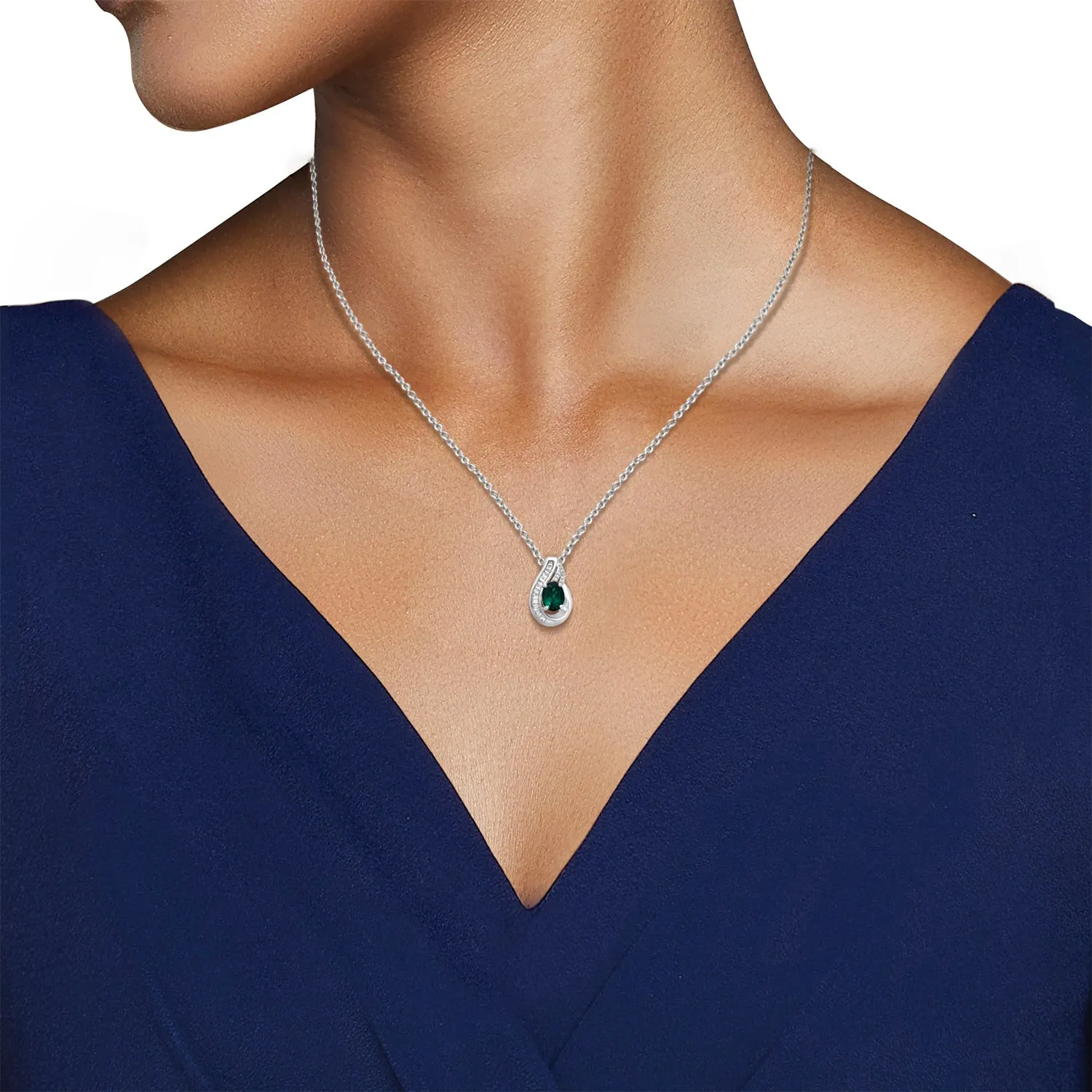Jewelili Sterling Silver Oval Shape Created Emerald with Round and Baguette Cut Created White Sapphire Flame Pendant Necklace